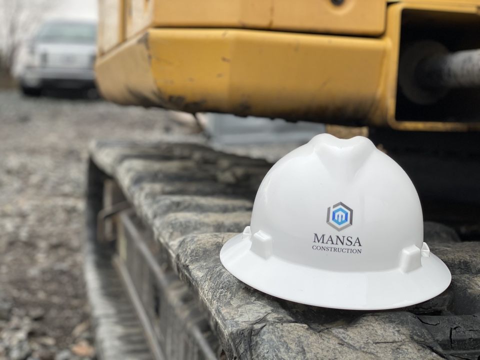 Construction hardhat on excavator track